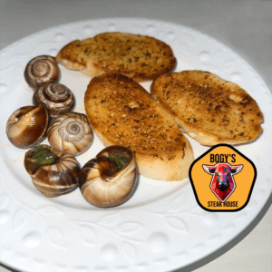 Weinbergschnecken mit Knoblauchbutter (Escargots) mit Knoblauchbrot